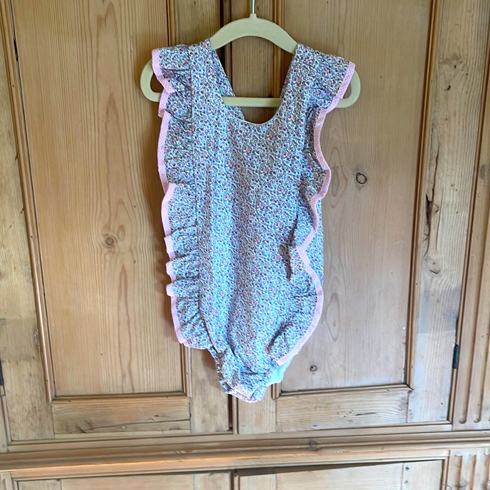 Cecil and Lou size 5 liberty print swimsuit with ruffle.